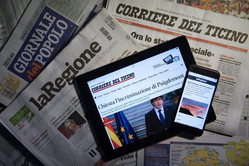 In Ticino si è passati da sette a tre e ora a due quotidiani, che offrono anche servizi online (Ti-Press)