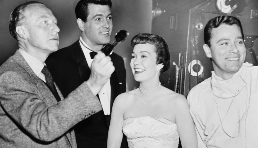 Da sin. Douglas Sirk, Rock Hudson, Jane Wyman e Ross Hunter sul set di Magnifica ossessione (1954) (Keystone)